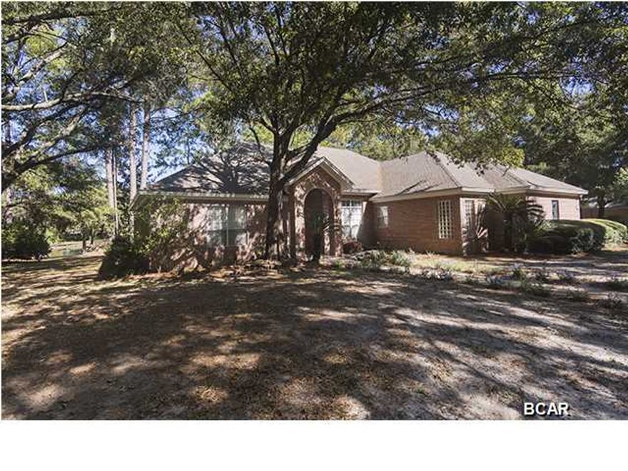 PRETTY BAYOU HEIGHTS - great neighborhood in Panama City, FL. Located just 3 blocks to 23rd St where you will find shopping, entertainment, dining and less than 1 mile to Gulf Coast State College and Florida State University ... Panama City branch. Just over the Hathaway Bridge and you're at Panama City Beach. 3/2.5 w approximately. 2,717 SF custom built all brick home situated on .8 of an acre on Hentz Lake. 180' of panoramic water view. Express your individuality in this spacious home. LR with formal dining area has travertine tile floors and 14' ceiling. Corner fireplace to take that chill off on these cool winter nights. You will enjoy this large open kitchen with breakfast area that looks out bay window to the lake. Large laundry room with deep sink and a walk in pantry. Cozy