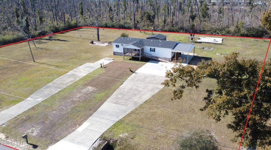 CURRENTLY UNDER CONTRACT, SELLER ACCEPTING BACKUP OFFERS. Immaculately kept, centrally located, and tucked away at the end of the street on 1.8 acres. Bright and open main rooms with split plan for the bedrooms. Master bedroom and master bath are very spacious with a 7'x10' walk in closet. Both guest rooms are well sized and proportioned. Oversized laundry room with sink is just inside the rear door. The nice screened-in front porch is a perfect space for a morning cup of coffee. Also an open back patio, great for entertaining. Covered concrete parking area just out the door makes nice for getting in and out of the house on rainy days. 2 driveways offers plenty of parking space for all of the toys. The 19x19 workshop sits on a concrete slab and just out the back door for easy access and st