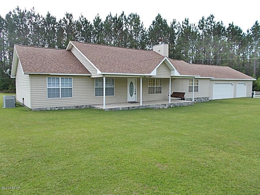 Executive home just outside of town with 10 acres, open floor plan with cathedral ceiling in the living room with a working fireplace for those cool afternoons, the dining room has lots of natural lighting with bay windows overlooking the back yard and tile floors, tastefully updated kitchen with all stainless appliances, large master bedroom with a second fireplace and large master bath and master closet,large laundry room with w/d  and freezer that will convey with home,New roof with architect shingles and a lifetime warranty was installed in April,2015 This home is a must see, call agent to view it today, very easy to show.