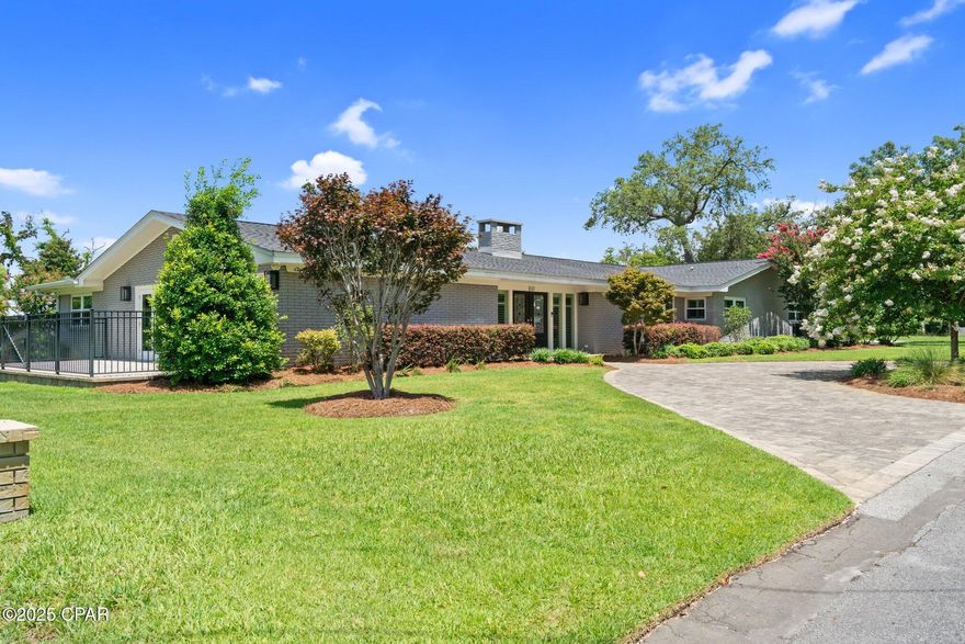 Fabulous over the top totally remodeled one story home with too many upgrades to mention, but I am going to try! Amazing views of Saint Andrews Bay from the living room and side patio. The property includes 2 lots and could possibly be subdivided. It is perfectly level and  completely fenced with privacy and aluminum fencing. Two kitchens, with a potential in law suite. Dual HVAC and architectural  roof were replaced in 2019. The entire house was renovated in 2019, including bathrooms and kitchens. There are quartz countertops, Brizo luxury hardware and a built in R/O water filtration system. Large laundry room with a built in icemaker. Primary suite features a gorgeous bath  with a walk in marble shower and the most amazing Jacuzzi tub and chandelier for your ultimate relaxation. The toliet  in the primary suite is equipped with a ''Toto Washlet'' remote controlled bidet. Custom automated window treatments with remote controls and plantation shutters throughout the house. Gas fireplace with remote control makes the great room feel so cozy! Beautiful engineered wood flooring throughout. All windows and doors were replaced in 2019 with hurricane impact rated doors and windows. 12 x 20 insulated storage room in the backyard. 2 car garage with epoxy floor coating. New irrigation system installed in 2024 is on a deep well system . Ring security cameras/floodlights and ring video doorbell provide excellent security. No HOA fees!! This is just an amazing house in an incredible location convenient to downtown and an easy walk to St. Andrews.