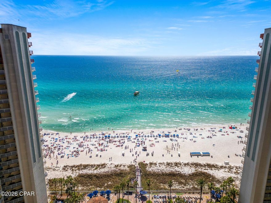 Welcome to Shores of Panama #2009 -- one of the most sought-after vacation destination condos in Panama City Beach. This stunning 20th-floor residence offers breathtaking panoramic views of the Gulf of America and the resort's world-famous lagoon-style pool, all from the comfort of your private balcony.

Located in the iconic Tuscan-inspired Shores of Panama, this beautifully maintained 1 bedroom + bunk room, 2 bathroom condo is designed to maximize both comfort and rental potential. Inside, you'll find luxury vinyl plank flooring and tile throughout, an open living area filled with natural light, and floor-to-ceiling views that capture the beauty of the Gulf and the spectacular resort pool below.

The primary bedroom features a king bed and private ensuite bath, while the bonus bunk nook provides additional sleeping space and is conveniently located next to its own private hallway bathroom -- ideal for guests and vacation renters.

The condo is being sold fully furnished and rental-ready, making it a perfect turn-key investment or personal beach getaway.

Shores of Panama is known for having one of the most impressive resort pools in the entire Florida Panhandle, along with a full suite of amenities including:

• Massive lagoon-style beachfront pool
• Indoor heated pool
• Multiple hot tubs
• Fitness center
• Sauna and steam rooms
• Private movie theater
• On-site dining and resort services

This unit also includes a rare deeded parking space, a highly desirable feature for owners and guests.

Whether you're searching for a high-performing vacation rental or your own Gulf-front retreat, Unit 2009 at Shores of Panama delivers the ultimate Panama City Beach resort lifestyle.