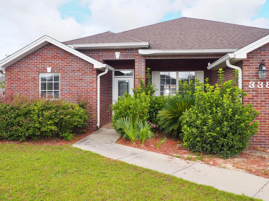 Beautiful must see brick home in the quiet Forest Walk Subdivision. Newer well maintained home is close to Tyndall AFB, schools, parks, ball fields, shopping, and water activities. Lovely landscaped yard with covered front porch is a nice hangout on those cool evenings. Plenty of natural light throughout the house from the energy efficient insulated windows with treatments. You'll love the privacy and separation of the split bedroom floor plan. The master bedroom with high tray ceiling and plenty of space is just off the kitchen and breakfast room. The master bathroom is like a spa with a separate Jacuzzi tub and shower with a large walk in closet. The additional bedrooms are spacious with large closets and ceiling fans. If you need an office the first bedroom would be perfect with it's separate location from the other bedrooms and view of the front yard and street. Tile is throughout the major traffic areas, kitchen and bathrooms for easy cleanup. The large kitchen is stylish and functional with Corian counter tops and beautiful wood cabinets. The open family room has high ceilings and space above the cozy fireplace to for an entertainment center. The breakfast bar and room is a perfect place for that quick meal or snack. The foyer opens into the formal dining room with beautiful lighting and large windows looking out onto the front yard. Enjoy your morning coffee or BBQ, rain or shine, under the large cover back porch. The roof is scheduled to have new 30 year dimensional shingles installed in time for closing. Pull right into the spacious two garage with automatic opener to unload your groceries or kids in any kind of weather. Nice low traffic neighborhood with sidewalks for those evening strolls. At todays low interest rates and the Hurricane Michael relief fund now is a great time to buy.