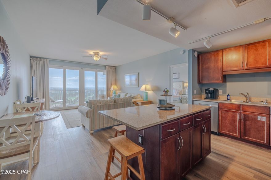 OPEN HOUSE SATURDAY JANUARY 17th from 1pm - 4pm. Beautifully Updated 3-Bedroom Gulf-View Condo at Laketown Wharf. Discover the perfect blend of value, space, and luxury in this beautifully decorated 3-bedroom, 2-bathroom condo at Laketown Wharf Resort in Panama City Beach. Offering over 1,260 square feet of coastal living, this 18th-floor unit comfortably accommodates up to 8 guests and boasts one of the largest floorplans on the beach. Step onto the oversized private balcony overlooking the lake and unwind as the nightly light and fountain show dances below—an unforgettable experience right from your own condo. Interior Highlights include: The owner's suite features a king-sized bed, scenic views, balcony access, and a spa-inspired ensuite with double vanities, a large soaking tub, and separate walk-in shower. The second bedroom offers a queen-sized bed, ample closet space, and easy access to the hall bathroom. A third bedroom includes bunk beds tucked into a private nook—perfect for kids or guests. The kitchen is fully stocked and ready for your convenience, featuring granite countertops, a breakfast bar, and an adjacent dining area for easy entertaining.
Laketown Wharf Resort Amenities include:
Private beach access just across the street—mere steps to the sand and famous cocktails at Pineapple Willy's. Five pools, including a rooftop pool, zero-entry pool, shaded pool, island pool, and a splash zone for kids, Two hot tubs and expansive sundecks, 52,000 sq ft boardwalk with nightly light & fountain shows, Putting green, outdoor gazebos, and daily pickleball action,    Gulf-view fitness center - a 2-story gym with cardio, weights, sauna & steam room. Onsite restaurants & bars, retail shops, and Laketown Market for beach essentials. Brand new entertainment venue (opened Feb 2025) at the Convention Center - with bowling, video games, food, and massive screens to catch all your favorite sports! Covered parking garage, 24/7 security, and multiple high-speed elevators. Whether you're searching for a vacation getaway, investment property, or a primary residence, this turn-key condo offers it all—space, comfort, resort amenities, and unbeatable location in the heart of Panama City Beach. Ready to see this incredible unit for yourself? Call today to schedule your private showing!