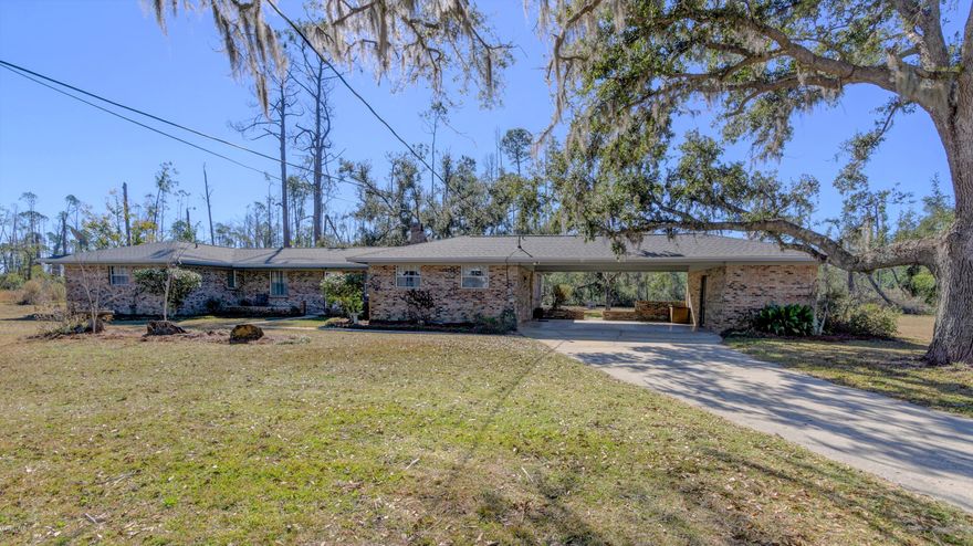 RANCH STYLE BRICK HOME ON 2.7 ACRES WITH A POND! BRING YOUR HORSES! Live in a country setting while still being close to town. The interior features 3 good size bedrooms, 2 full baths, a 24x18 living room with wood burning fireplace (great for entertaining), a huge 16x13 dining room (perfect for gatherings), an XL interior laundry room (extra storage space), and a new HVAC (2019). The kitchen has wood cabinets with built-in pantry and all appliances convey. The exterior features a 2 car carport, a good size utility room for extra storage, a yard building for lawn equipment, a well for irrigation, a pond, a new fence around some of the property and a New Roof.  Sale includes the South Portion of parcel 08567-010-000. 100% FINANCING AVAILABLE.  Measurements approximate.