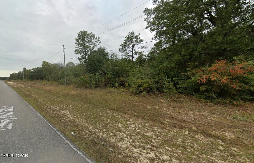 Discover this golf course lot in Sunny Hills, ideally located along Country Club Blvd. The lot appears to back up to Hole 10 on the Sunny Hills Golf Course, offering a peaceful setting with potential golf course views.  The property should have access to community water and electric, though buyers should verify all utilities for this specific parcel. Enjoy the area's nearby lakes, fishing, swimming, picnic spots, and outdoor recreation, with shopping, Northwest Florida Beaches International Airport, and Panama City Beach just a short drive away.

Additional non-adjoining lots are also available for purchase from the seller. Buyer to pay owner's title policy and title company closing fee. Buyer to verify all measurements, zoning, utilities, golf course frontage, and building requirements.