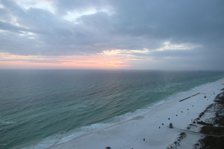 This is a perfect floor height, right off the elevators.   NO CARPETING IN THE CONDO.  Wood look tile flooring in the bedrooms and living room.  The KITCHEN IS HUGE for a 1bd.  Just the perfect beach-front condo.  INCLUDES WASHER/DRYER.