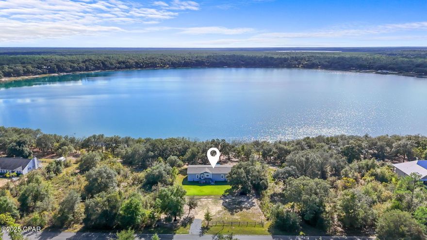Enjoy serene country living in the gated Leisure Lakes community with this stunning 2021 waterfront home boasting 100 feet of lake frontage. Spanning nearly 2,000 sq. ft., this open-concept beauty features trey ceilings, a spacious kitchen with a large island and double sinks, and a luxurious primary suite with dual shower heads and a built-in bench.

Designed with quality and comfort in mind, the home includes modern finishes, 9-ft ceilings, 2x6 exterior walls, and a Culligan Premier water system—plus over $65,000 in upgrades.

Set on a 1-acre lot, there's plenty of room to garden, entertain, or unwind by the lake from your 60-ft dock. Residents enjoy private lakes, fishing, a community pool, and scenic walking trails, all just a short drive from Chipley and Panama City.

Modern comfort meets relaxed Florida living at 4505 Leisure Lakes Dr.

Schedule your private showing today
furnishings negotiable.