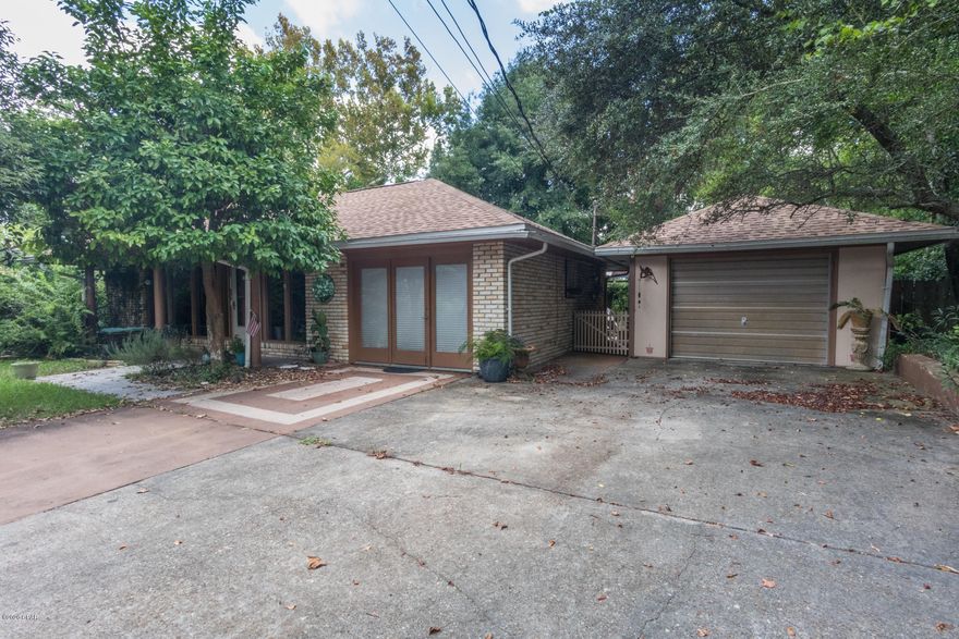 This private 3bedroom, 2 bath home is located close to the beach, Frank Brown Park and Pier Park. Fish from your own back yard on your private dock on the fresh spring fed pond. Located at the end of a cul da sac with only 4 homes on the street for the ultimate privacy. Beautiful patio and the home has a new roof, and ac unit.  Formal dining room, wood burning fireplace,Move in ready.