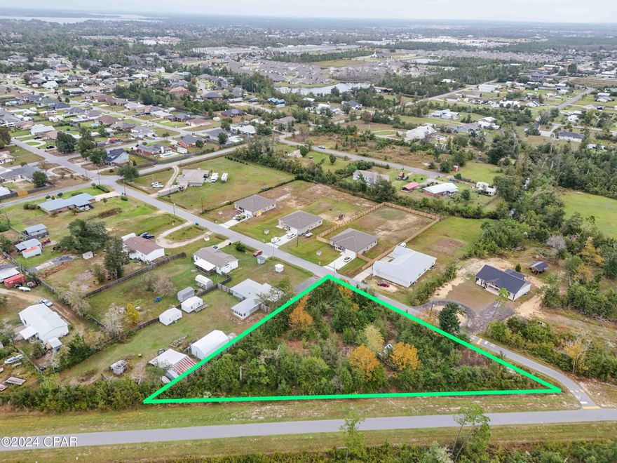 Large New Construction Building Lot or Mobile Home Lot for Sale. Zoned R2. Many new built construction homes in the area.  Almost an acre in Lynn Haven area. Not in City Limits. Land had a mobile home on it previously.  Located at the Dead End of Kirkwell Ave. The Lynn Haven Trails newly put in are on the old railroads tracks that pass near the property line. Great location for someone wanting to walk these trails!