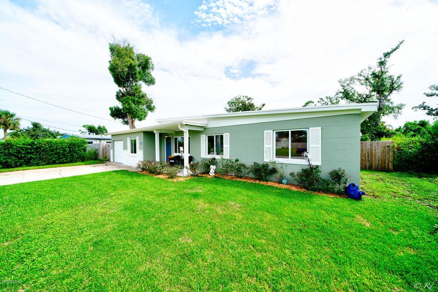 **CURRENTLY UNDER CONTRACT, SELLER ACCEPTING BACK UP OFFERS** Beautifully updated solid block home in the popular St. Andrews area with an inviting landscaped/fenced-in back lawn and patio for entertaining. The interior has a coastal flare throughout the over 2000 sq ft boasting 4 BR's/2 BA's, 2 living areas, and gorgeous kitchen with custom upgrades PLUS a bonus room for a 5th BR, office or mancave! Remodel included NEW electrical, water heater, HVAC, stove/oven, stainless appliances (fridge, microwave, washer/dryer CONVEY with the sale), walk-in pantry, farm sink, custom cabinets/countertops, barn doors, exterior doors, windows, paint, flooring, shiplap, fence, and MORE! Updated workshop and separate well/irrigation system for the lawn. Home stood strong with recent panhandle storms!