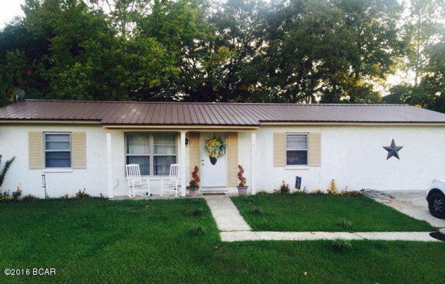 Cozy 2/2 block home has been recently updated with new carpet, paint and new CH/A unit. Home offers a living/dining combo, galley kitchen, split floorplan, master bedroom has walk in closet and bath. Garage was enclosed to make a bonus room that could be a third bedroom or office. Sun room is off dining area. There is an extra lot that goes with sale. Backyard on both lots is fenced. Outbuilding. Great investment opportunity in Sunny Hills. Home is on Community water and sewer.