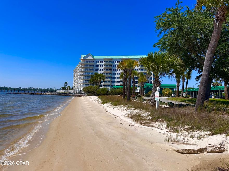 Luxury Waterfront Living with Deeded Boat Slip & Private Garage at Marina Bay! Welcome to one of the most beautiful and distinctive waterfront communities along the shores of Panama City--where luxury, privacy, and coastal living come together in spectacular fashion. This stunning corner residence at Marina Bay offers over 2,000 square feet of beautifully designed living space, complete with a deeded 30-foot covered boat slip, a private detached garage, and an additional covered parking space--an exceptionally rare combination for waterfront condo living. Inside, you'll be welcomed by a bright and airy open floor plan filled with natural light and framed by floor-to-ceiling windows showcasing breathtaking bay views from nearly every room. The spacious living area opens seamlessly onto a large bayfront balcony, creating the perfect setting for morning coffee with dolphin sightings or evening sunsets over the water. The beautifully remodeled kitchen has been thoughtfully reconfigured to maximize both style and function, featuring a large island, granite countertops, custom backsplash, stainless steel appliances, and abundant storage. Designed for privacy and comfort, the luxurious waterfront primary suite is tucked away from the guest rooms and features private balcony access, coffered ceilings, a spacious walk-in closet, and a spa-inspired bath with dual vanities, exceptional storage, a jacuzzi tub, and separate shower. The guest accommodations are equally impressive. One bedroom offers a private en-suite bath, coffered ceilings, walk-in closet, and marina-view balcony, while the oversized third bedroom features its own private entrance, tray ceiling with accent lighting, and walk-in closet--ideal as an in-law suite, office, or hobby space. Residents of Marina Bay enjoy a beautifully maintained, non-short-term-rental community with resort-style amenities including: Bayfront pool & hot tub, fitness center, private marina w/ boat slips, fishing pier, community room, and a private beach area. Recent community improvements include a newer roof, fresh exterior paint, resurfaced walkways, and a newly paved parking lot. Low HOA fees and healthy reserves help simplify maintenance, allowing you to enjoy a truly carefree waterfront lifestyle. Whether you're a boating enthusiast, full-time resident, or searching for a peaceful coastal retreat, this extraordinary property offers an unmatched blend of elegance, convenience, and bayfront beauty. Corner waterfront condos that include a covered boat slip and private garage rarely become available--schedule your private tour today!
