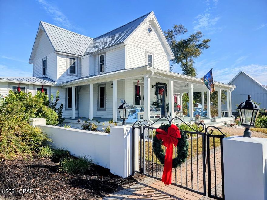 'CURRENTLY UNDER CONTRACT, SELLER ACCEPTING BACKUP OFFERS' ~  BAY FRONT LOT with Gorgeous Home ~ Grab your Realtor quickly, this ''To Die For'' Bay Front Property in the highly sought out St. Andrews Bay area... won't last long!!! This Historic home has 4 Bedrooms, 3 Baths, 2 Car Garage PLUS an RV Garage, Elegantly Gated & Fenced Property, Heated Pool surrounded by Pavers... all on over a half an acre with 68' of Bay Frontage. You will love waking up to have your morning coffee on the oversized Front Porch that looks out to The Bay. The Master Bedroom is on the main level. New 40 yr Roof '2019, Pool '2018, HVAC '2019, IMPACT RESISTANCE WINDOWS '2019, Frig '2018, W&D '2017, Sprinklers on Well. Ready for Dinner... just a short stroll to several restaurants and shops Downtown.   Hardwood Floor '2019, Front Porch floor painted Dec. '2021, Pool is 5'+ Deep, Sellers were told you can build a Dock on the Beach Area, 33' RV Parking Inside Garage