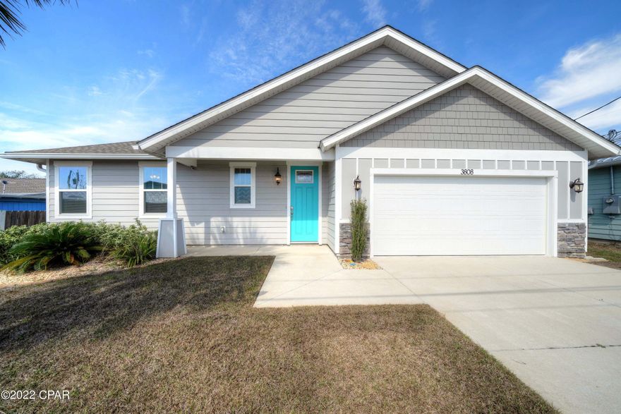 Just like new home in Panama City Beach! 3 bedrooms, 2 .5 baths, garage and a great open layout for easy beach living. Perfect for full time, part time or a vacation rental. Tile floors, quartz counter tops, ship lap accent wall, a covered porch and fenced in back yard are just a few of the features.  NO HOA and short term rentals are allowed. Easy beach access at the end of the street and only 1/4 mile to the boat ramp on the lagoon. Close to St Andrews State Park and only a short drive to Pier Park.  Call today and make this your next home away from home!