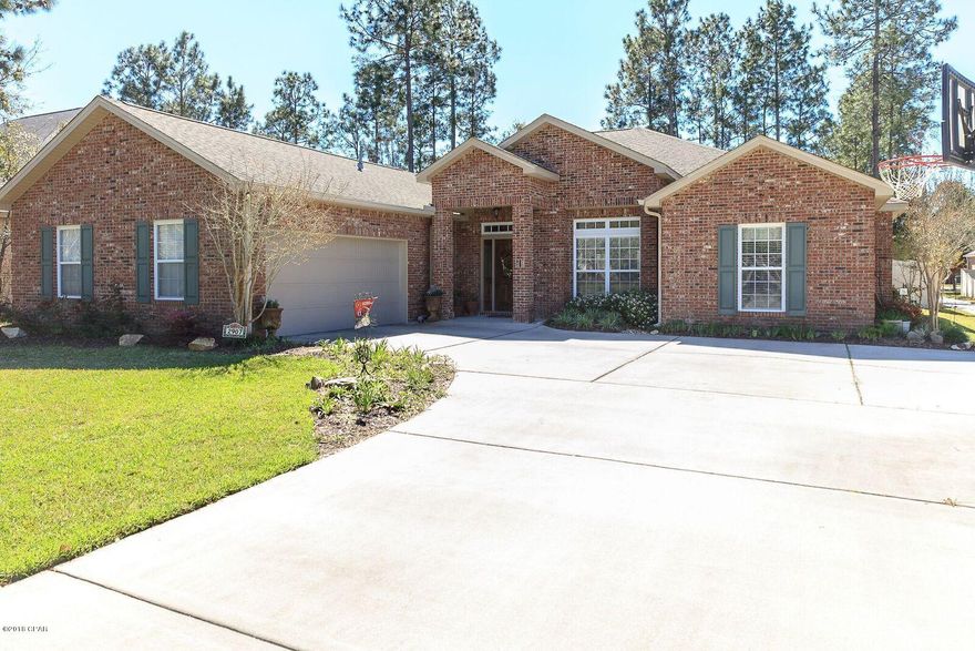 GREAT PRICE REDUCTION ON THIS IMMACULATE HOME IN HAWKS LANDING! This home boasts 2,400 sq ft, 4 bedrooms and 2 1/2 baths and offers so many upgrades and extras you must see it to appreciate what it offers. This is a real custom built home. The detail and flow is obvious in every room. The open floor plan and split bedrooms are perfect for any family. This is a TRUE 4 bedroom. Stately features like trey raised ceilings, custom crown molding, wainscoting, and more. The kitchen features custom cabinets, gorgeous granite counter tops, stainless appliances,double oven, GAS STOVE and large breakfast nook and breakfast bar.The living room/dining room is open and bright featuring cozy fireplace. The flooring is a combination of custom tile and carpet throughout. The large master bedroom was designed to include a separate reading area. The master bedroom also has his and her walk-in closets and beautiful trey ceiling. The master bath is sheer elegance with a large soaking tub, cultured marble double vanity, water closet, large linen closet and separate shower. The other bedrooms are spacious and have big walk-in closets and a large bath between them with double vanity. One of the best custom features is the 1/2 bath for guests and the FABULOUS laundry room that you must see to believe! Outside is a side-car garage entry, large drive-way, gravel path between the home and neighbors, fenced in backyard and covered patio for grilling and still plenty of room for a pool in the backyard. The  sprinkler system uses reclaimed water. The garage offers double storage closets in addition to attic storage. This home has been wired for a whole-house generator and the generator comes with the home and is serviced annually.  This is a 1-owner home and they have been meticulous with the care and the maintenance. There are not many all-brick TRUE custom built homes like this at a price like this in a great subdivision. This neighborhood is centrally located and is close to Tyndall Air Force Base and the Naval Coastal System Station. The association fees are inexpensive and Hawks Landing is just steps away from Bay Haven Charter Academy.  Make an appointment to see this beauty today!