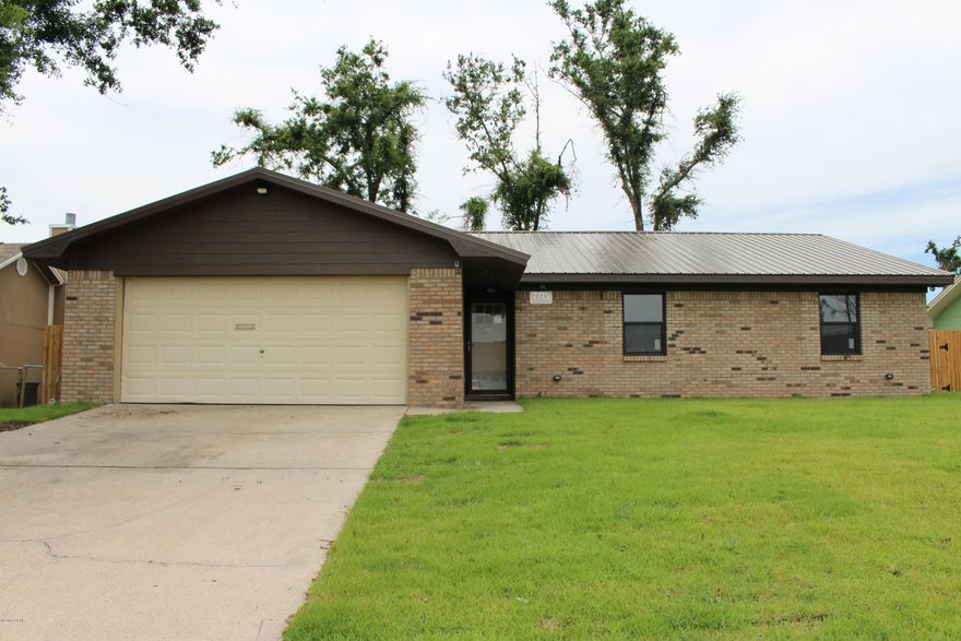 Completely renovated energy efficient home only 3.5 miles to Tyndall Air Force Base. With brick frontage and metal roof, the street appeal will impress. As you walk into the home, you will find a large open living space with vaulted ceiling, wood burning fireplace, wood look laminate flooring, granite counters, stainless steel appliances, and glass tiled backsplash. The Master bedroom has track lighting, walk in closet and the ensuite you've dreamed of with marble tiled shower, and double vanity. The 2nd and 3rd bedroom are spacious and have built in cabinets. You'll enjoy the peaceful, fully fenced yard and rear patio area. Double garage features storage cabinets. Rent includes yard maintenance & Pest Control. The owner pays for irrigation water usage. Pets Neg.