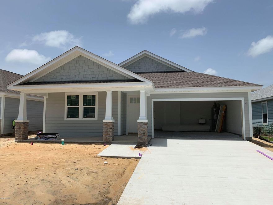NEW CONSTRUCTION SHEARWATER GOLD 3/2-located in Panama City Beach's desired Breakfast Point subdivision built by Southern Coastal Homes-Offering quick easy access to TAFB, the white sandy beaches of the Gulf of Mexico, Publix anchored shopping center, Breakfast Point Academy-Rated A (walking distance)and the famous Pier Park. INTERIOR features of this coastal inspired home offers a private grand Foyer entrance, large volume Great Room with an open floor plan, kitchen with 4 burner gas cooktop, center island, custom cabinetry with soft close drawers and stainless steel appliances, Master Suite with tray ceiling, expansive tiled shower, double vanity and large walk-in closet. Large covered patio just off Great Room makes this home perfect for entertaining. EXTERIOR-This SHEARWATER GOLD home features a 2 car garage, covered lanai, covered front porch, fully sodded yard with Rain Bird sprinkler system. This home includes all of the GOLD STANDARD FEATURES LIST and DESIGN BOARD with upgraded finishes including Luxury vinyl plank flooring, custom cabinets, granite solid surface countertops, 50/50 stainless steel undermount sink, tiled back splash, Moen "Eva Style" plumbing fixtures, Whirlpool stainless steel "Gourmet Kitchen" appliances, stainless sink and much more. See the GOLD STANDARD FEATURES LIST, available DIAMOND ADDITION items and finish board in the document section of this listing. 
Gold Appliance Package Includes: 30" Chimney Hood in Stainless Steel: 4-Burner Gas Cooktop in Stainless Steel: Countertop Microwave with Trim Kit in Stainless Steel: Front-Control Dishwasher in Stainless Steel: 5.0 Cu. Ft. Single Wall Oven in Stainless Steel: