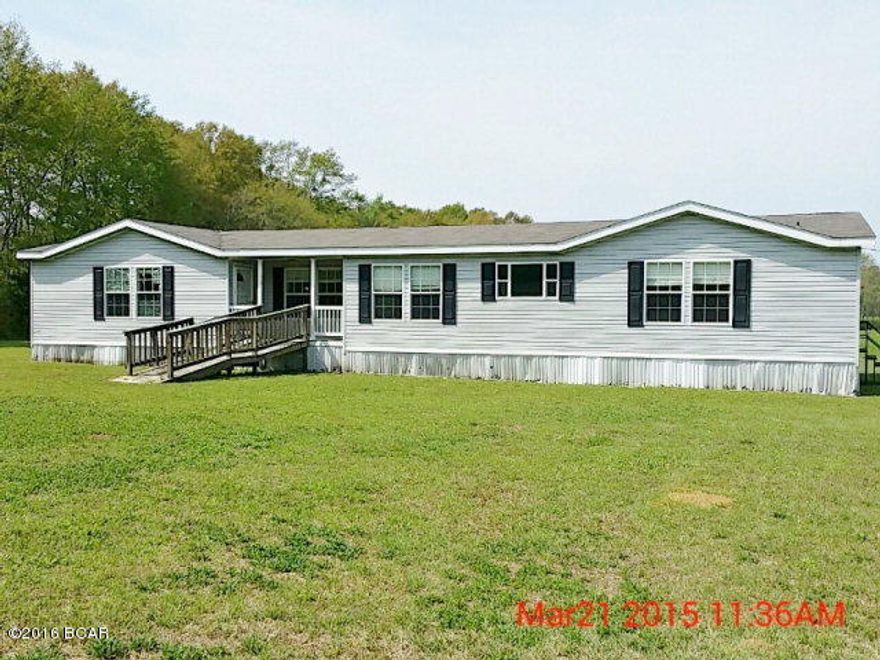 Huge 2006 Mobile Home with 4 bedrooms, 3 baths and 2208 square feet. This home features a huge living room. Kitchen has island and cook-top stove with custom tile and plenty of cabinets and storage space. Has a large master bedroom and master bathroom has a garden tub with separate shower. The flooring has been removed from most of the rooms and will need to be replaced. Refrigerator and dishwasher have been removed but has stove and oven. Property is located just three miles outside of Graceville, Florida and home sits back away from paved Highway 171 in a quiet, peaceful location. All offers must be submitted via PropOffers.com by the Buyer Agent Only.