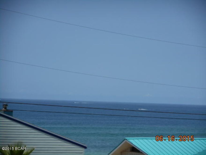 The perfect beach get away or full time residence. Fantastic gulf view from large back deck. Building is half a block off the beach, with easy beach access. Tiled floors throughout. Loft area with bedroom furniture and possible attic area for extra storage. A/C is about 7 years old. Low maintenance fees. Only 8 units in this building and located in a quiet area near St Andrews State Park.