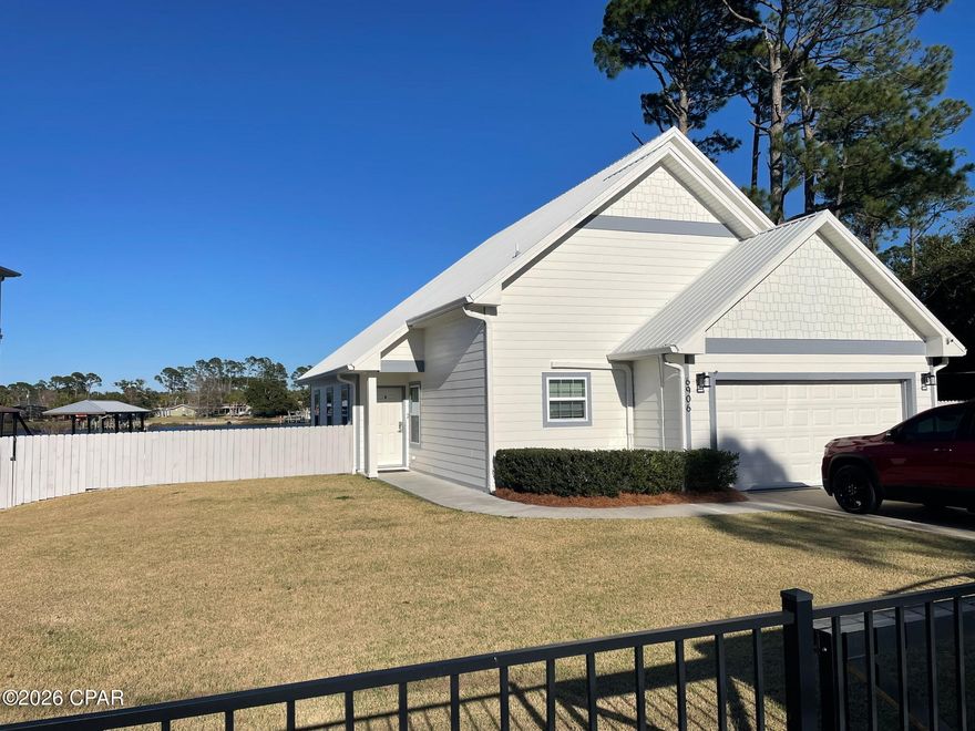 Enjoy waterfront living on Grand Lagoon in this 3 bedroom, 2.5 bathroom home offering 1,692 sq ft of comfortable coastal living. This lagoon-front property features a private dock with boat lift, providing direct access for boating, fishing, and enjoying the water right from your backyard. Relax and take in peaceful water views while being just minutes from the beaches, St. Andrews State Park, marinas, restaurants, and shopping. Perfect as a primary home, vacation getaway, or investment opportunity.