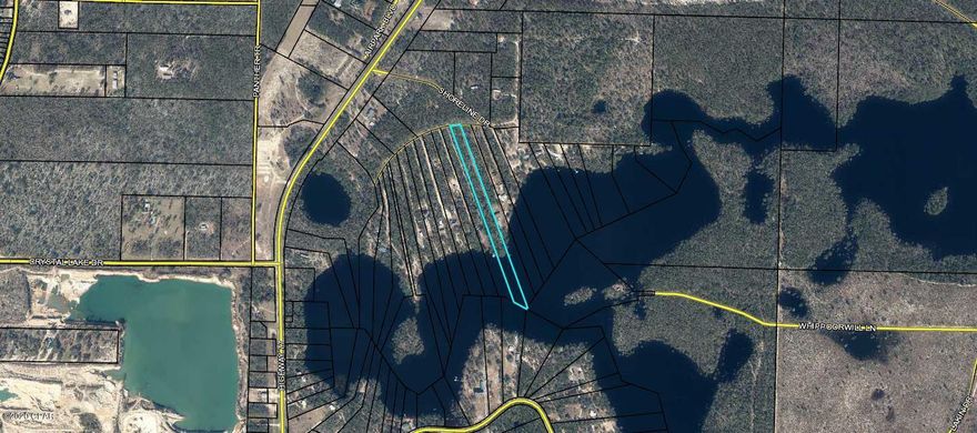 Great chance to buy on River Pond. This beautiful 4.5 acres will make a wonderful private getaway or just a summer camp. When full, this lake does allow gas powered marine vehicles and also connects to 9 other lakes. There's a beautiful white sandy beach for your enjoyment, and it's only a 20 minute drive from Lynn Haven. Sellers have put a power pole on the property, but have left the rest au-natural, for you to create the space of your dreams.   All measurements are approximate.