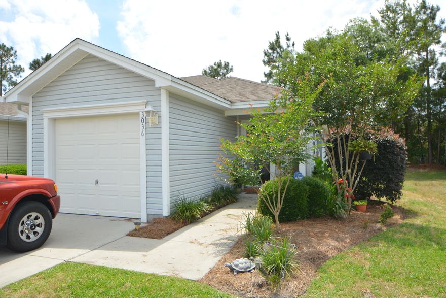 Don't wait! Larger than average Hammocks townhouse thanks to the beautiful heated and cooled Sun Room on the rear of this home. Super low maintenance in the desirable Hammocks neighborhood which is conveniently located and has a community pool. The open floor plan is super for entertaining with an open and bright kitchen, large dining area and spacious family room. The kitchen features a breakfast bar with pendant light, a fantastic built-in pantry, tile backsplash and all appliances (washer & dryer stay as well). The sun room on the back of the house is flooded with natural light - a great reading room, office or craft room. Additional features include plantation shutters, single-car garage AND it is a desirable corner unit. HOA covers lawn care. Call your Realtor today - these go fast!