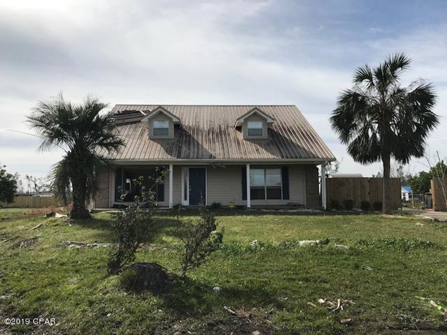 This property is being sold As Is due to damage from Hurricane Michael. Do not enter the home as it is unsafe. Home has extensive structural damage.  This 3 bedroom, 2 bath home features living room/dining room combination with a fireplace, eat in kitchen with island, laundry room and the master bedroom downstairs.  The two additional bedrooms and a bathroom are upstairs.  The garage was converted to use as extra living space.  The damage to the home is extensive and includes windows, roof, trusses, chimney, siding, walls, insulation and drywall.  The property is just under a half acre and includes well, septic, electric, some fencing and a shed.  There is plenty of parking for boats or campers.  All offers considered.