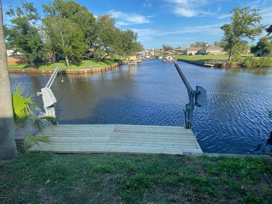 Waterfront Townhome....looking out at an intersection of a canal..... Very nice water view....3 bedroom and 2.5 baths...updated remodel, fireplace, new roof.  Conveniently located . Easy to see. Rear windows facing canal . ...new boards installed on dock.