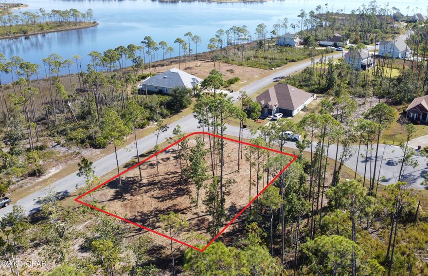 UNDER CONTRACT TAKING BACKUP OFFERS. Spectacular Water view home site in the desirable Laird Point! One of the rare lots in the community that has no wetland setbacks. Build 2 story to catch panoramic views of the Bay and Bayou. At just over .30 of an acre, this corner lot offers plenty of space to build your dream home. Laird Point is a gated waterfront peninsula that borders East Bay and Laird Bayou. Ribbon curbed streets and underground city utilities. Amenities include tennis court and rv/boat storage. Quiet and private with great proximity to TAFB, Mexico Beach, and Panama City Beach. Beautiful coastal style homes throughout the community. Schedule your visit today!