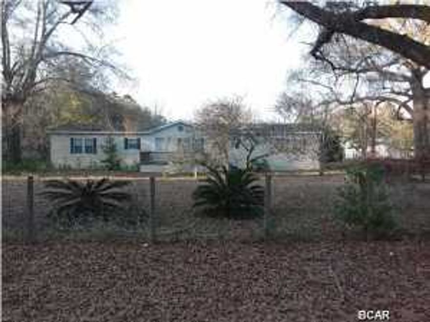 This Home is located in quite neighborhood of Wewahitchka , close to shopping, schools, river and dead lakes for great fishing. Offers a doublewide mobile Home, fenced in yard, large lot, two storage sheds.