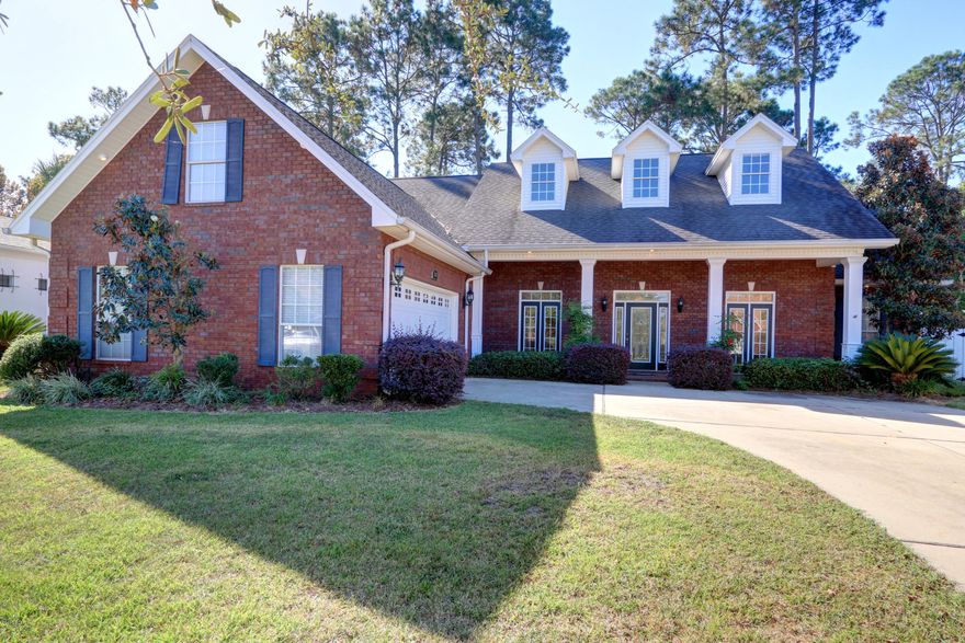 JUST REDUCED, BEST PRICED HOUSE IN THE HAMMOCKS!!!!!! Stunning custom built 4 bedroom 2.5 bath brick, split floor plan home in the Hammocks. Home boast quality features and accents such as 10 ft. ceilings, decorative columns, hardwood floors, surround sound, extensive crown molding, chair rails, fireplace, an office, new carpet, exterior of the home have been recently painted and so much more. The bright and cheery chef's kitchen has custom cabinets, stainless appliances, breakfast bar and to complete the room there is a cozy breakfast nook. You will find the master suite is a haven for relaxation with a sitting area, which is a perfect place to enjoy your favorite book, very roomy walk in closets and the master bath has a tile shower, double vanities and a Jacuzzi tub. Home also has a large bonus room on the second floor which could be used as a fourth bedroom.  There is a climate controlled area in the garage which offers endless possibilities for it's use.  Exterior features include privacy fenced back yard, a nice screened porch, sprinkler system and extensive landscaping, This house is a MUST see, that won't last long at this PRICE, call for your private showing today.  All ages, sizes including sq. ft. are approximate, measure if important.