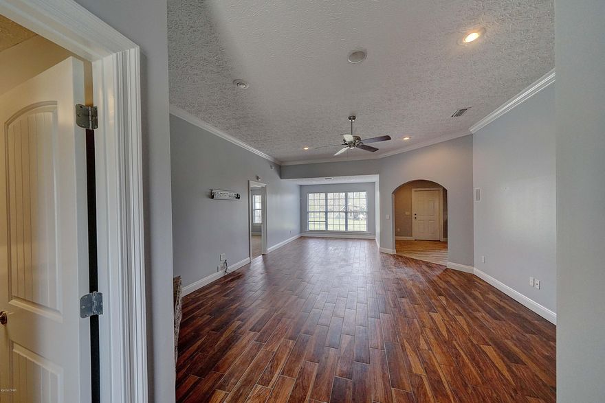 URRENTLY UNDER CONTRACT, SELLER ACCEPTING BACKUP OFFERS' This beautiful brick home is located on a quiet street with a bayou waterview! Inside features a spacious living area with hardwood floors, a fireplace, recessed lighting and a split floorplan! The kitchen has stainless steel appliances and the master bathroom has double vanities, a garden tub as well as a big separate shower! This is a perfect home with enough space inside and out for a growing family!