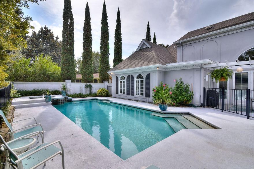 Calling all executives and all people with great taste! This is truly a ''dream'' home, full of gorgeous details and extras. With a stunning entrance, walk into your home with pride! Two bedrooms and 2 baths are upstairs and the Master Bedroom and another guest bedroom are downstairs. Two more bathrooms are also downstairs for a total of 4. There is more to tell. Outside is an in-ground pool and the driveways are fantastic. One is a circular drive and the other driveway leads to the garage. Enter a gated community complete with roving security and you should surely feel safe and secure. Did I mention you have a golf course in your back yard as well? Buy this one and experience some nice moments in Bay Point!