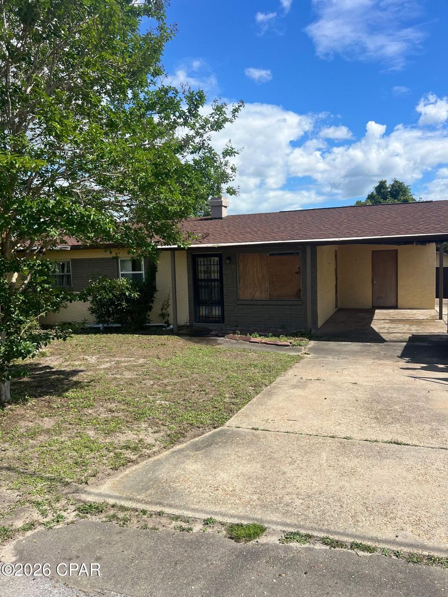 Opportunity awaits with this spacious 4 bedroom, 2 bathroom situated on an oversized lot near Panama City. Offering 1,504 square feet of living space, this home features tile flooring, a bright living and dining room combination, and a large family room with a cozy fireplace. The open kitchen includes a breakfast bar and overlooks the main living areas, creating a functional layout with plenty of potential. The primary suite features a private bath, while the additional bedrooms are spacious and filled with natural light. Outside, the detached garage provides added storage, workspace, or parking options, and the oversized yard offers room to expand or create your ideal outdoor space. Conveniently located just a short distance from downtown Panama City, shopping, dining, parks, and the beautiful Gulf Coast beaches. Perfect opportunity for investors, renovators, or buyers looking to customize a home in a great location. All information recorded in the MLS is intended to be accurate but cannot be guaranteed, buyer advised to verify. Sold As-Is