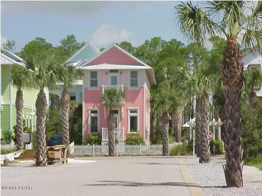 Located in the Cottages of Carillon Beach.  This is a gated community with about 1 mile  of uncrowded private beach. Master bedroom has an open deck overlooking the quaint cottage area.