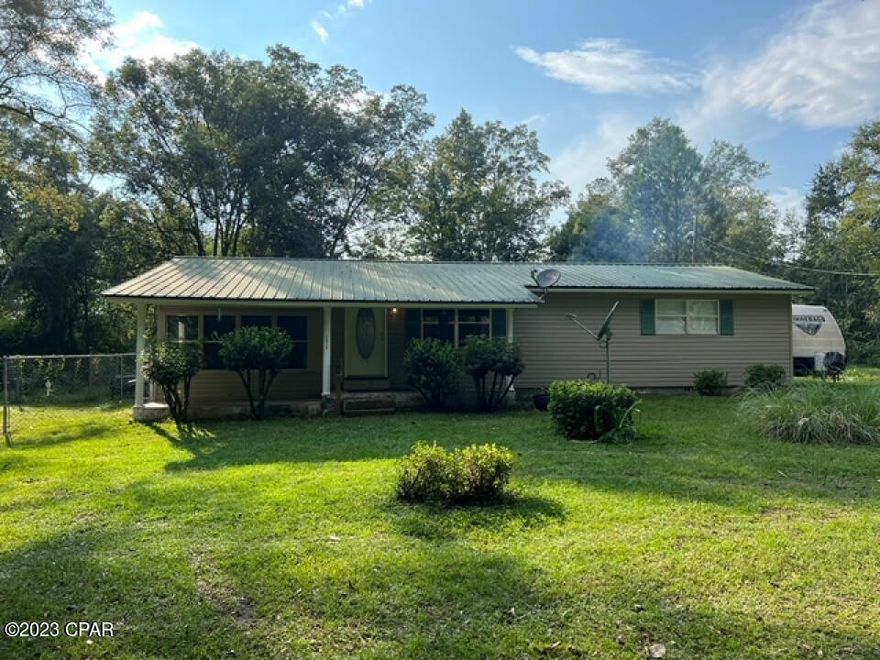 Come see this lovely property in Noma. Nestled on a beautiful nearly half-acre lot, you'll fall in love with the relaxing atmosphere as soon as you pull up to the house. With 3 bedrooms and 1 bath, this nearly 1248 square foot ranch is perfect for new families, empty nesters, or anyone looking for quiet living near the border of Alabama, and only 60 miles away from Panama City Beach. This is a property that is waiting for you to make it uniquely yours. Your new living room is well designed and you'll find the kitchen has young appliances. You'll love the covered porch, which will quickly become your favorite place to have your morning coffee while you enjoy the serene atmosphere around you. Your new backyard is partially fenced in and mature trees provide shade and privacy.
