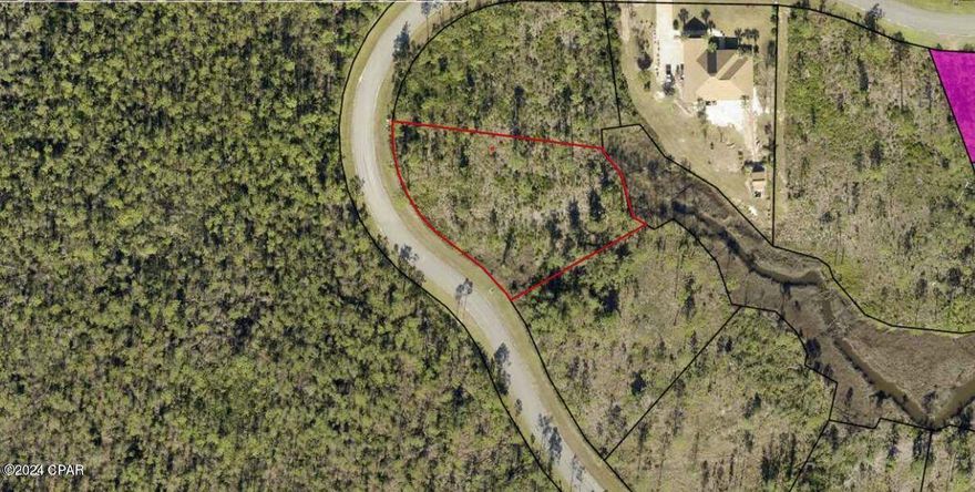 Check out this EPIC lot at a GREAT price! 
 Laird Bayou is a hidden GEM; come and experience the incredible beauty of the area. Build your dream home in this gated community and live just down the street from the boat dock and boat ramp to get to some of the best fishing and recreational boating in East Bay. Or relax at the community pool, complete with a bath house, and enjoy the peace and quiet of this area. Bring your RV and keep it in the boat/RV storage area. This magnificent lot is over 3/4 acre and awaits your dream home! Laird Bayou is comprised of site-built custom homes in the low-country/plantation style with flexibility in design. 1800 SF minimum homes with 1300 minimum SF for main floor on multi-level homes. Existing homes range from the high $400k's to over $1.2M
