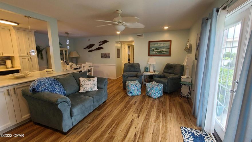 Stunning ground floor unit with views of the Bay at Landmark Condominiums in St. Andrews.  This 2 bedroom condo was gutted after Hurricane Michael and COMPLETELY REMODELED!  Brand new soft close cabinets and new countertops added to the opened kitchen, all new bathroom with custom tile work, and vinyl plank flooring throughout.  All appliances were replaced, new AC w/Smart Thermostat and new water heater in the remodel process.  Come see  before it's sold!  All measurements are approximate.