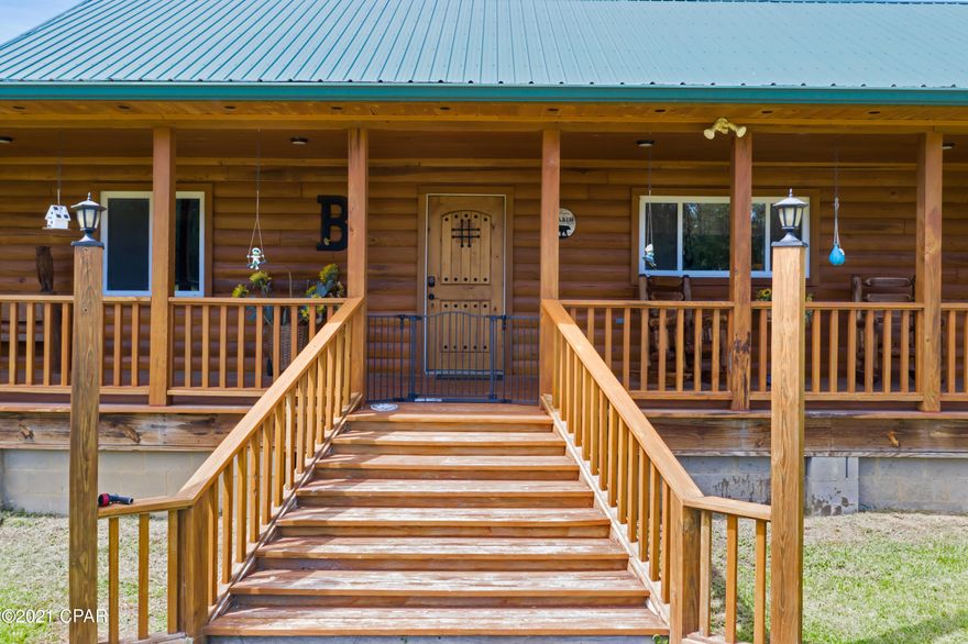 CURRENTLY UNDER CONTRACT-SELLER ACCEPTING BACKUP OFFERS. Dreamy 2018 3 Bed/3 bath, custom-built log cabin w/ over 5400 square ft under roof & approx. 3100 heated/cooled. This home showcases a beautiful 8 ft wrap around porch w/ two large screened porches.  The inside features large bedrooms, an open kitchen/dining area, & an upstairs suite w/ bathroom & walk in closet. A 2 car garage & a large parking pad add the finishing touches. The land encompasses over 51 ACR of timberland & pasture & includes a stocked pond with a flowing well, which keeps the water in pristine condition. There is cleared access to Wrights Creek on the back of the property, a horse barn, & a grand pole barn, all of which add additional appeal. Home is on a county maintained asphalt rd about 6 miles from Gracevill