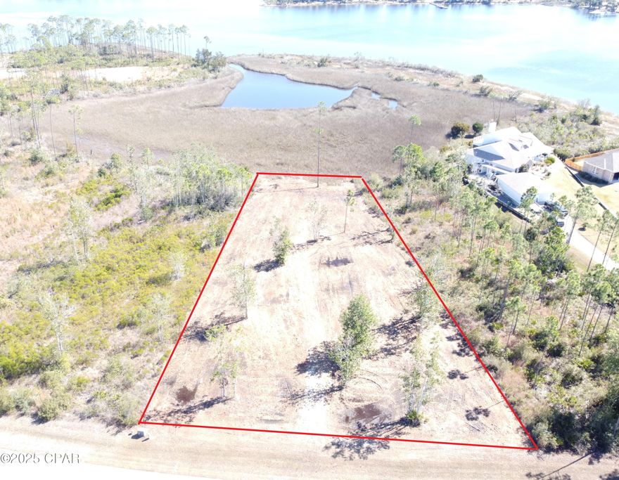 Amazing Waterfront homesite in the desirable Laird Bayou. Breathtaking views from nearly every direction. Enjoy wonderful breezes off East Bay. At over .60 of an acre there is plenty of room to build your Dream Home. Laird Bayou is a gated waterfront community with beautiful custom homes. Ribbon curbed streets and underground utilities. Amenities include a Pool, Boat Launch with Day Dock and RV & Boat Storage. They recently added a high end fish cleaning station on the dock. Just clean your catch right there! Seller has already had an elevation certification and soil sample completed. He also has house plans that he will provide at closing. Great proximity to TAFB and Mexico Beach. East Bay is home to some of the best flats fishing in the state and just a short boat ride to the Gulf of Mexico. Schedule your private tour of Laird Bayou today!