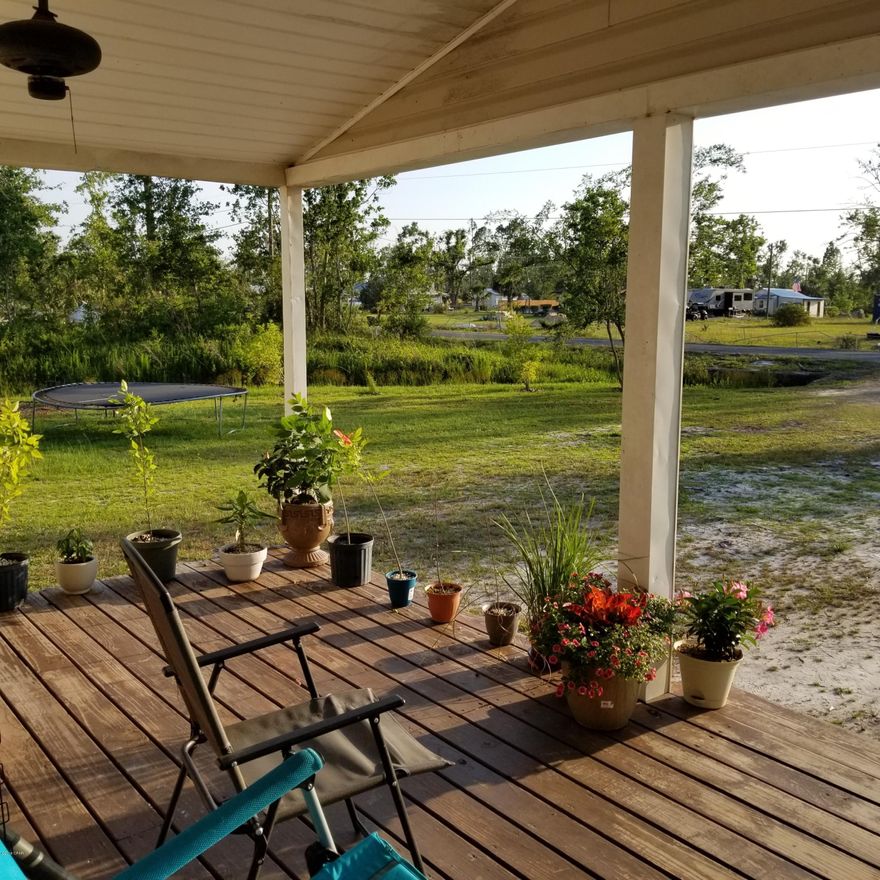 Large yard with 2 driveway entrances.  Nice open front porch, 3 Bedrooms and 2 full bathrooms, with BONUS ROOM Currently used as a pool room (comes complete with pool table and sticks) .  Kitchen has a lot of counter space and cabinets including an island.  Stove, Refrigerator and dishwasher will stay as well as washer and dryer.  Roof was replaced in 2010.  Minor damage to skirting around home from hurricane Michael and a couple parts of the chain link fence is bent.  Being sold AS IS,   Free Home Warranty valued at $600 and $2,000  Carpet Allowance with ACCEPTABLE OFFER!!!