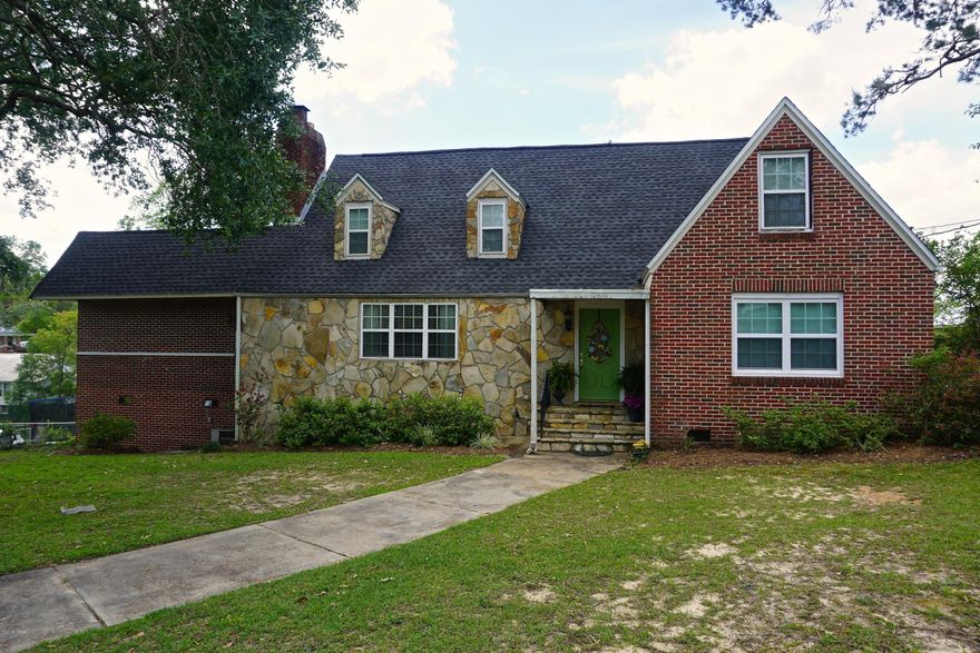 CURRENTLY UNDER CONTRACT, SELLER ACCEPTING BACKUP OFFERS. Charming older home located in the heart of downtown Marianna that has been beautifully remodeled and updated. The home features original hardwood floors throughout living and dining areas, built in shelving frame the fireplace, and repainted kitchen cabinets. There is a newly added on large master suite with laundry room and master bathroom featuring new tile, double vanity, and walk-in shower. The master also has french doors that lead to a balcony overlooking the large fenced in backyard. There is additional bedroom on the main floor that is currently being used as a playroom. Upstairs there is a small bedroom with large closet, a full unique bathroom with a lot of storage, and another large bedroom. There is an attached carport, additional driveway and parking pad, and basement