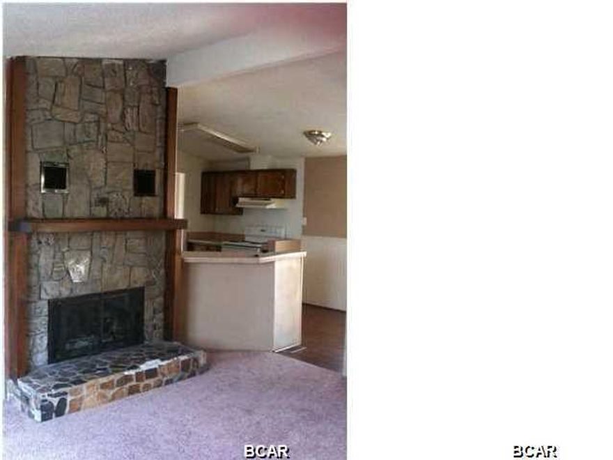 This 3 bedroom 2 bath doublewide mobile home features: nicely sized living room with a built in nook that would be perfect for your computer, stone fireplace, additional den area, kitchen equipped with refrigerator, stove/oven & dishwasher, plenty of cabinet space, separate dining area open to the living room, central heat & air. Master bath has a large mirrored vanity with plenty of counter space. Washer & dryer included. This home must be seen in person to appreciate. Centrally located in Lynn Haven. Some pets are negotiable with a $150.00 non-refundable animal fee per animal - No dogs.