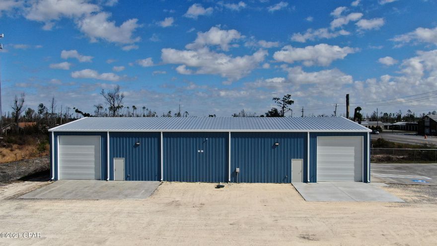 New 5,000 sf Building which is divisible into 2,500 sf sections with separate bathrooms. Which sits on (1) one acre with 190' frontage with two access points The building has 16' eave with (2) 14' x 14' roll up doors on either side end of building and two (2) ADA bathrooms. Zoned C-3, which allows for outside storage. Price includes fenced and graveled yard plus a well and electric to designated sign location. Owner spent the money to hook to City water and sewer too, so no issues long term. Gem of a property and great buy and hold with long term income. Perfect for 1031 exchange or moving your savings into real estate