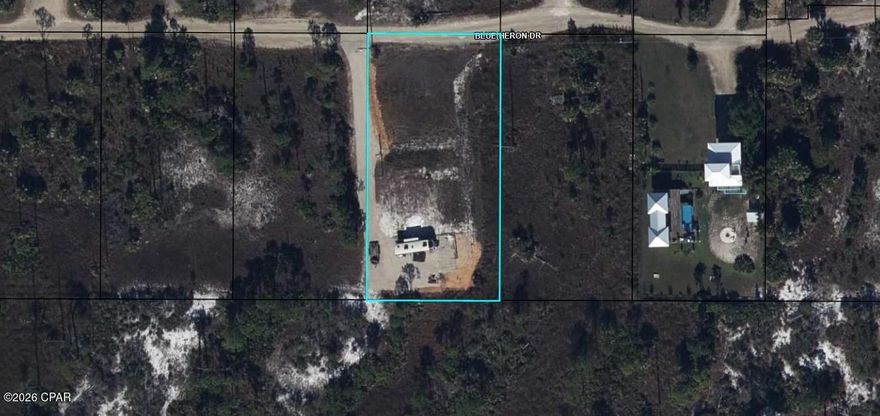 Prime half acre lot zoned mixed use (commercial or residential) and ready to build with grandfathered in septic in the middle of the property and city water, power and an RV on it.  RV does not convey.  There is also a parking pad on the backside of the property.  This lot is zone residential or commercial and has deeded access to the Bay.  It is also within walking distance to local restaurants.  The water tap is already paid and there is access to city sewer.  The state park is across the road from this property.  Go see it.  Signage coming soon.