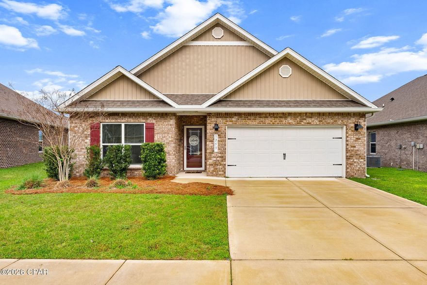 Discover this beautifully cared-for 2023 all-brick home in the sought-after Andrews Plantation community of Lynn Haven. Offering 4 bedrooms, 2 bathrooms, a 2-car garage, and 1,835 square feet, this residence features an inviting open layout designed for both everyday comfort and effortless entertaining.
Inside, you'll find raised ceilings with 10-foot tray details, elegant crown molding, and luxury vinyl plank flooring throughout the main living areas. The thoughtfully designed kitchen is the heart of the home, showcasing stainless steel appliances, granite countertops, brushed nickel finishes, and an oversized island with cabinetry on both sides--perfect for gathering with family or hosting guests. Energy-efficient windows fill the space with natural light, enhancing the home's bright and welcoming feel.
The primary suite serves as a private retreat, complete with a spa-like bathroom featuring a relaxing garden tub, a spacious glass-enclosed walk-in shower, and dual vanities. Step outside to enjoy peaceful views from the screened porch overlooking a peaceful back yard an ideal setting for morning coffee or evening relaxation.

Additional highlights include an irrigation system utilizing reclaimed water and professionally landscaped grounds on a quiet cul-de-sac. Ideally situated just minutes from top-rated schools, shopping, dining, parks, boat ramps, and more, this home offers the perfect blend of modern convenience, comfort, and serene surroundings.
Move-in ready and impeccably maintained--don't miss the opportunity to make this exceptional property yours - call your favorite Realtor today.
