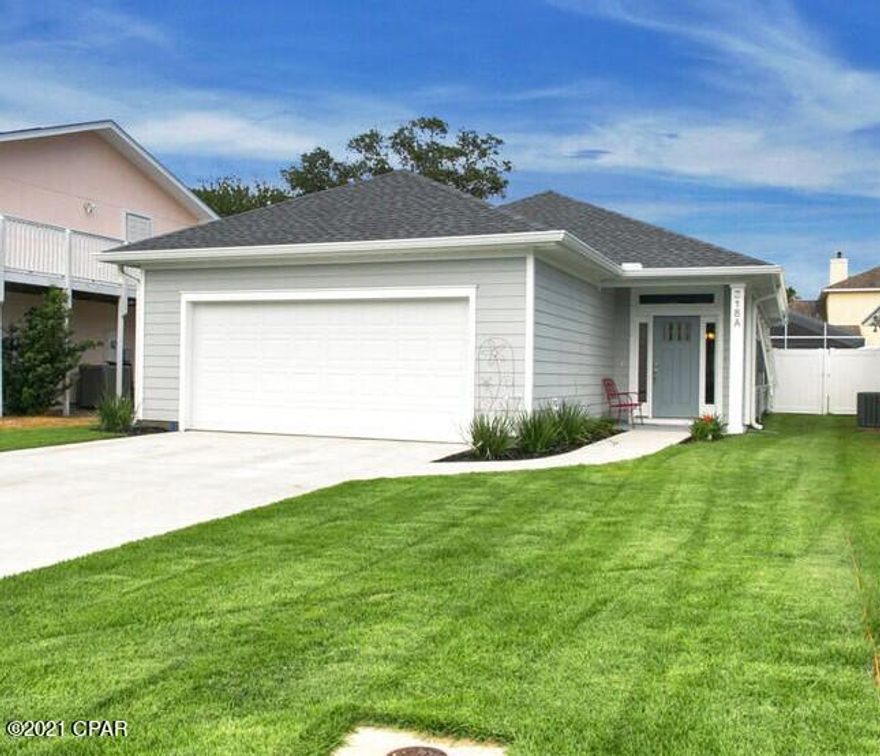 Enjoy the good life in this Charming home located on the west end of Panama City Beach. Within walking distance to the sugar white beaches and emerald waters of the Gulf of Mexico, this meticulously maintained home is nestled on a peaceful quiet street in Southfields. Fantastic location that is close to 30A, Pier Park, restaurants, shopping, and the airport. The property features an open living/ kitchen design with coffered ceiling, beautifully accented with crown moulding. Several windows bring in lots of natural light giving the space a great ambiance. The kitchen includes modern white cabinets, stainless steel appliances and a large island with Marble countertops. Spacious master bedroom offers en-suite master bathroom with walk-in closet for convenience and privacy.  Additional features include 9ft ceilings, luxury vinyl floors, quartz countertops in all bathrooms, a two car garage, hurricane shutters, gutters, irrigation system and large fenced in yard (which could easily fit your dream pool). This is a family and golf cart friendly community. Flood zone X. Survey available. All info is approx. and must be verified by Buyers.