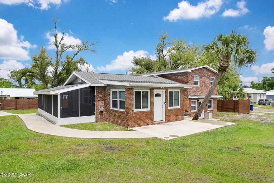 Classic brick home, only 2-blocks from Watson Bayou! This charming 4-bedroom/2-bath home with 2,300 sqft sits on a corner lot of almost half an acre, completely fenced in with 2-double gates for access on each street. There's a screened in Florida Room on 2 sides of the house and a wraparound concrete walkway. Split floor plan with 2 bedrooms on the lowest floor that share a full bathroom with beautiful vintage tiles, also the laundry room and utility room with a brand new HVAC and an exterior door. Main floor has 3 entrances, open concept with original hardwood floors in the Living /dining area and accent brick wall. Kitchen has tile floors with decorative mosaics, stainless steel appliances, gas stove and granite countertops. The front door and kitchen door have direct access to the Florida room and there's a backdoor entrance in the Fireplace room. Master bedroom located on the upper floor with views of Watson Bayou. Master bathroom with double vanities and a very spacious guest bedroom currently used as an office. The property was previously updated with all new vinyl windows, electrical, plumbing and a new roof 2-years ago, there's also a nice workshop with a covered porch for all the yard tools. All Information is deemed to be reliable, but is not guaranteed, buyer to verify if important.