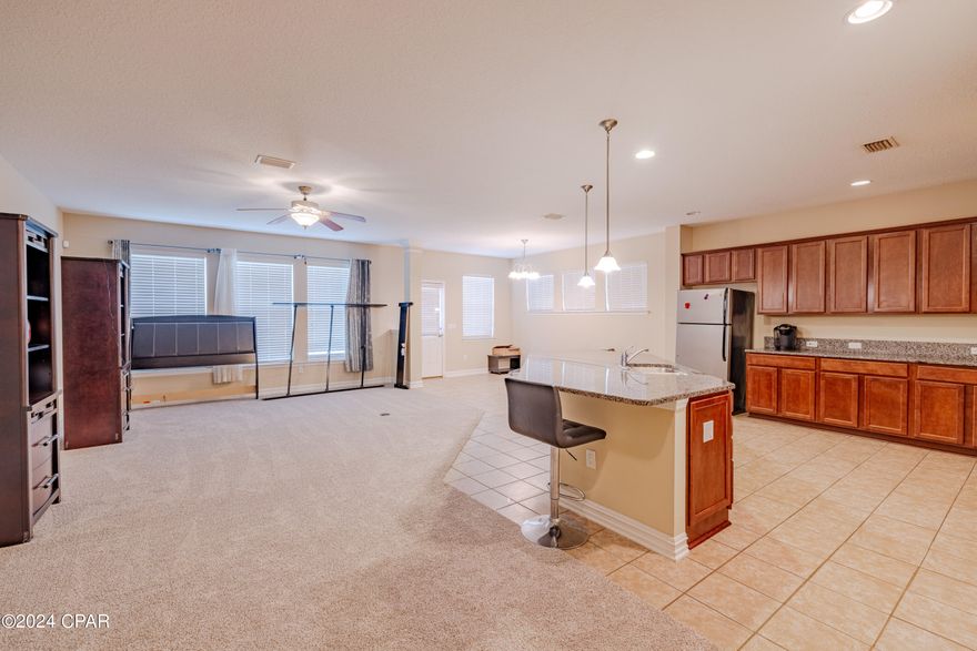 Very nice well-kept home in the sought after Breakfast Point subdivision.  Home is centrally located to all the amenities of Panama City Beach and walking distance to Breakfast Point Acadamy.  Home features low-maintenance ceramic tile flooring in kitchen, baths, and entrance.  Lovely new carpet in bedrooms and living areas.  Kitchen features an island bar with beautiful granite countertops and gas stove.  This is a must-see home.  All information is approximate.  If important to buyer, please verify.