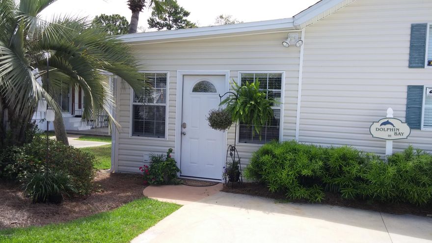 Motivated Seller!! This meticulously updated home is waiting for you to enjoy in the highly sought after EMERALD POINTE resort. The open floor plan with the kitchen overlooking the newly painted living room has a breakfast bar along with a new refrigerator, new microwave and a new washer/dryer. The 2 bed (one is a bunk room), 2 bath is perfect for a weekend retreat, a second home or an investment property. The beautifully decorated screened in patio is so relaxing with an oversized backyard. It's location is centrally located with equal walking distance between the two pools. Home is located on the palm tree lined street. This quiet and low maintenance resort has 2 pools, a hot tub, shuffleboard, a clubhouse and a catch and release lake. One of the friendliest golf cart gate the beach, golf courses and St. Andrews State Park. The HOA fees are some of the most reasonable on the beach!  Everything is covered except your electricity!  Seller keeps ALL wooden pieces of furniture, personal pics, wall pics, knick-knacks, etc. The leather sofa, chair, lamps, bedroom furniture, patio furniture and appliances convey with buyer.  Lot and room sizes are approximate, please verify if important.